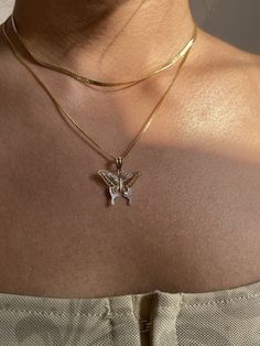 Give her the gift of wings with this beautiful butterfly necklace. DETAILS - 14k yellow gold butterfly with rhodium plating - Chain option is a 14k yellow gold cable chain - Both pendant and chain are 14k gold - Chain style may vary slightly - Approximately 13/16 inch wide x 7/8 inch tall (including bail) VARIATIONS If you require any variation of this style (a different style chain, longer chain, etc.) feel free to message us. We will do our best to accommodate you. Additional costs may apply depending on the variation. POLICY We do accept returns on this item minus a $25 restocking fee. Return shipping is the responsibility of the buyer. Any expedited shipping will not be refunded. If you have any questions, concerns, or are unsatisfied in any way with your order, feel free to message us Gold Butterfly Necklace, Hip Hop Poster, Butterfly Necklace Gold, Gold Butterfly, Butterfly Necklace, Butterfly Pendant, Beautiful Butterflies, Jewelry Pouch, Chain Styles