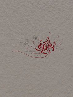 a red and white wall with some designs on the wall next to a butterfly that is flying in the air