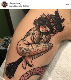 a woman with tattoos on her arm and leg