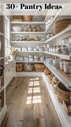 an open pantry filled with lots of white dishes and wicker baskets on the shelves