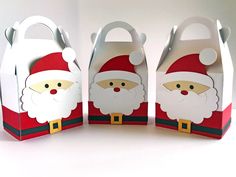 three paper bags with santa claus on them