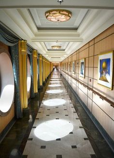 a long hallway with pictures on the wall