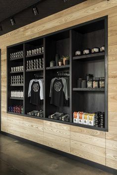 the inside of a store with wooden walls and shelves