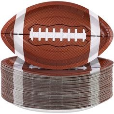 a football paper plate on top of stacks of plates