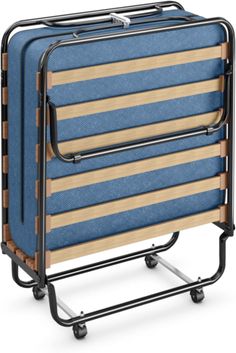 two blue suitcases sitting on top of a metal rack with wooden strips and wheels