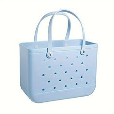 a large white bag with holes on the side and handles, sitting in front of a white background