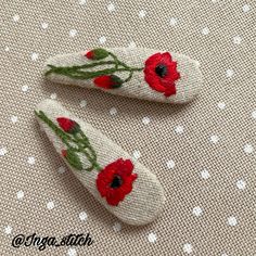 two red flowers on white fabric with polka dots