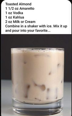 a glass filled with ice cream sitting on top of a table