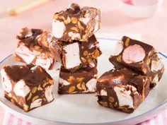 several pieces of chocolate and marshmallow fudge cake on a plate