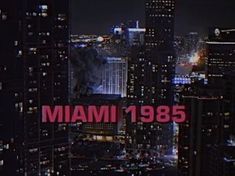 the city skyline is lit up in red and white with the word miami on it