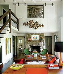 a living room filled with furniture and a fire place