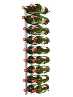 a wine rack filled with lots of bottles on top of a white wall mounted shelf