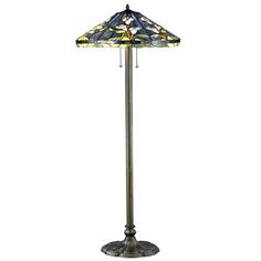 a floor lamp with a stained glass shade on the top and bottom part of it