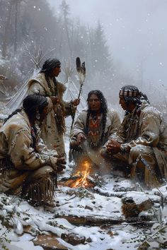 native american indians sitting around a campfire in the snow