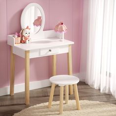 a white vanity table with a mirror and stool