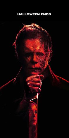 the poster for halloween ends shows a man with his hands folded over his face and looking down