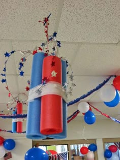 a red, white and blue party decoration hanging from the ceiling