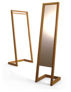 a tall wooden mirror sitting on top of a white floor next to a standing mirror