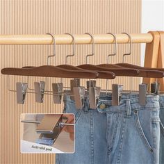 clothes hangers are attached to the back of jeans