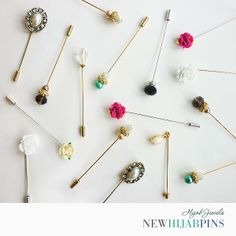 several different types of pins with flowers on them