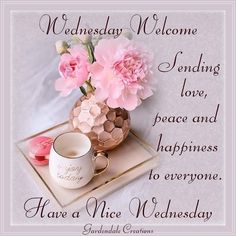 a vase with pink flowers and a cup on a tray that says, wednesday welcome sending love, peace and happiness to everyone