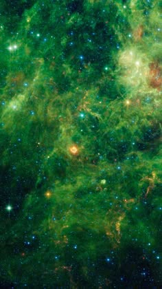 the large star cluster is surrounded by green and blue stars in this view from space