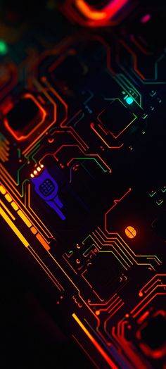 an electronic circuit board with colorful lights in the dark, close - up view from above