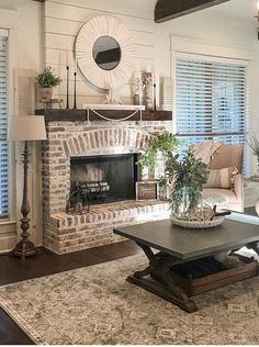 a living room filled with furniture and a fire place