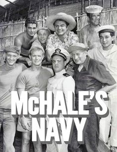 a group of men standing next to each other in front of a hut with the words michael's navy on it