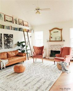 a living room filled with furniture and a fire place