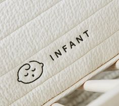 an infant mattress with the word infant written on it