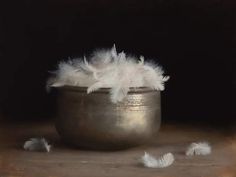 a painting of feathers in a silver bowl