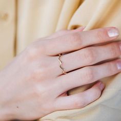 A dainty gold ring with zig zag pattern. A stacking gold ring for women, minimal and simple that adds glam to every outfit. This stacking wavy band can be used a an alternative wedding band as well. The best Mother's Day gift. 100% handcrafted with love!D E T A I L S● Metal: 14K solid gold, 14K white gold or 14K rose goldR I N G ∙ S I Z I N GFor General Reference:● we use standard US Ring Sizing● an average women's ring finger is size 6-7● each ring is custom made upon order, in any desired size Gold Wavy Rings For Gifts, Wavy Gold Rings For Gift, Minimalist Wavy Rings As A Gift, Minimalist Wavy Rings For Gift, Minimalist Wavy Rings As Gifts, 14k Gold Wavy Rings, Gold Wavy Rings For Anniversary, Minimalist 14k Gold Wavy Ring, Gold Wavy Promise Ring