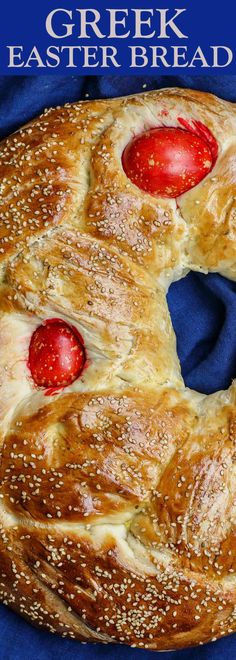 a close up of a bread with strawberries on it and the words greek easter bread