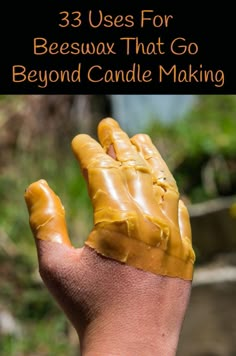 a hand with yellow paint on it and the words 3 uses for beeswax that go beyond candle making