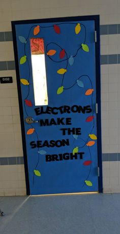 a blue door with the words electrics make the season bright