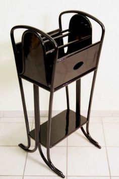 a black magazine rack with two magazines on it