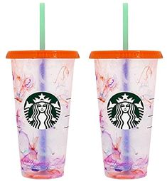 two starbucks cups with lids and straws are shown in front of each other on a white background