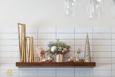 a shelf with christmas decorations on top of it