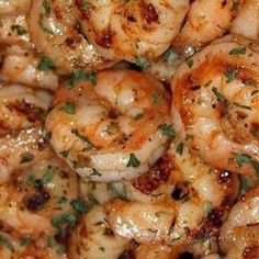 closeup of cooked shrimp with parsley on top