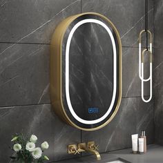 a bathroom with a sink, mirror and soap dispenser on the wall