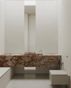 a bathroom with a marble counter top and white bathtub next to a bench in the middle