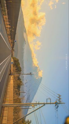 an image of the side of a mountain with power lines