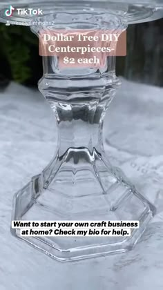 a clear glass candle holder sitting on top of snow covered ground with text that reads, dollar tree diy centerpieces 42 each