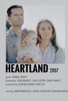 a man and woman holding a baby in front of a white background with the words heartland on it