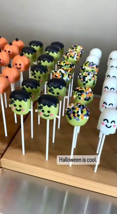 halloween cake pops with sprinkles and faces on them