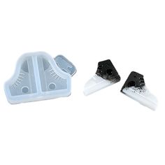 two pieces of plastic with black and white blades on them, one has a hole in the middle