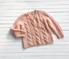 A wonderfully fuzzy and soft pastel peach sweater, made from Italian spun wool and mohair. This blend of yarn allows the sweater to be thick and chunky without being heavy. ☛   m e a s u r e m e n t s   ☚ Bust: 44 Length: 25 ☛   d e t a i l s   ☚ Era: 1970s Material: wool, mohair, nylon Brand: John Wanamaker Condition: excellent ☛   v i s i t   t h e   s h o p   ☚ https://etsy.me/2Nd23kg Mohair Wool, Chunky Sweater, Wool Sweaters, Women Pullover, Soft Pastel, Pullover Sweaters, Sweater Outfits, Jumper, Pastel