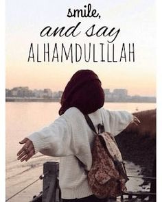 a woman with her arms outstretched in front of the water and text that reads smile, and say alhamdullillah