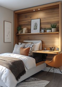 a bed sitting under a wooden shelf next to a desk